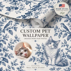 May include: A roll of white wallpaper featuring a blue toile-style pattern of flowers, birds, and butterflies. The text reads CUSTOM PET WALLPAPER CREATED FROM YOUR PHOTOS, DESIGNED WALL VALLE STUDIO, and MADE IN USA. It includes a cat illustration.