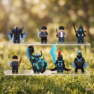 May include: A collection of eight plastic minifigures displayed on a clear acrylic shelf. The figures include armored warriors with blue glowing accents, characters with swords and shields, and a black bear figure with blue energy effects on its paws.