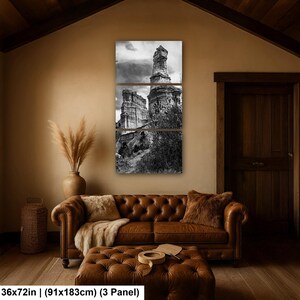 May include: A three-panel black and white wall art set depicting a tall rock formation and desert landscape. The artwork is labeled with dimensions of 36x72 inches. The panels are arranged vertically to form a single cohesive image of the terrain.