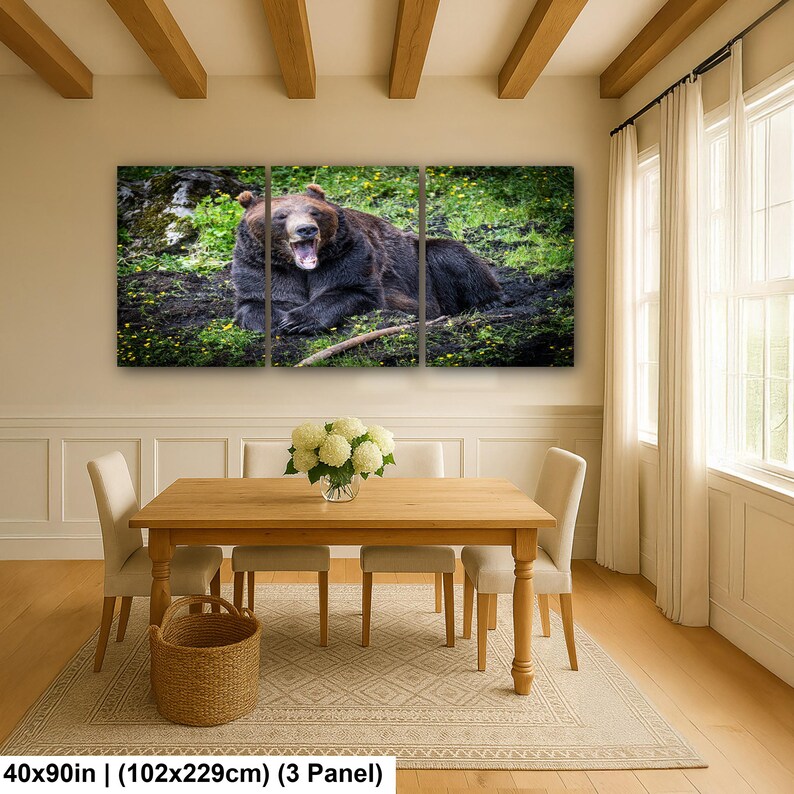 May include: A three-panel wall art set featuring a brown bear lying in a grassy, mossy area with its mouth open. The artwork measures 40 by 90 inches in total, displayed as three separate panels showing the bear in a natural environment.