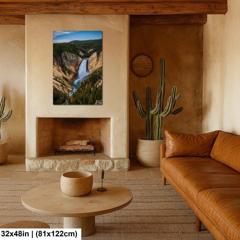 May include: A rectangular wall art print featuring a vertical landscape photograph of a waterfall cascading through a deep canyon with rocky cliffs and dense green pine forests under a blue sky, measuring 32 inches by 48 inches.