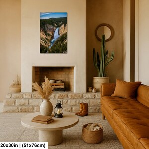 May include: A rectangular wall art print featuring a vertical landscape photograph of a waterfall cascading through a deep canyon with rocky cliffs and dense green pine forests under a blue sky, measuring 20 inches by 30 inches in total size.