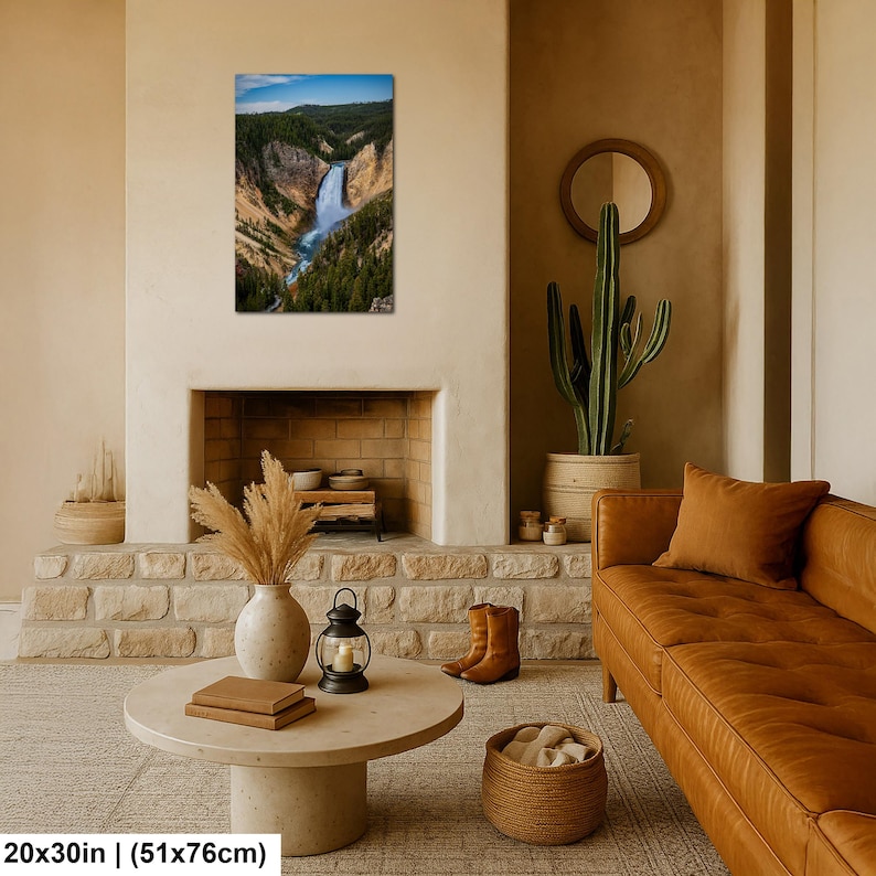 May include: A rectangular wall art print featuring a vertical landscape photograph of a waterfall cascading through a deep canyon with rocky cliffs and dense green pine forests under a blue sky, measuring 20 inches by 30 inches in total size.