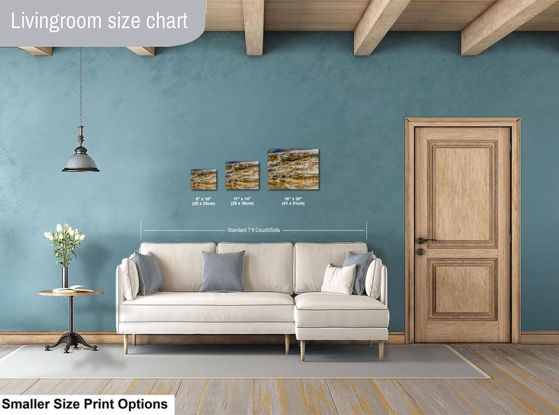 May include: A living room size chart displaying three rectangular landscape prints in sizes 8x10 inches, 11x14 inches, and 16x20 inches, positioned above a cream-colored sectional sofa. The text "Livingroom size chart" and "Smaller Size Print Options" appear.
