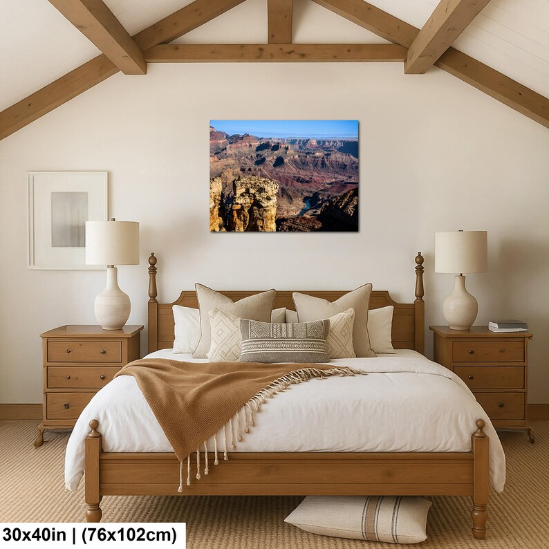 May include: A rectangular wall art print featuring a landscape photograph of the Grand Canyon with deep red rock formations, a winding river, and a clear blue sky. The print measures 30 inches by 40 inches and is displayed on a white wall.
