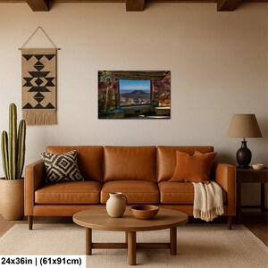 May include: A rectangular wall art print measuring 24 by 36 inches, depicting a landscape view through a stone window frame. The scene shows a distant mountain peak under a clear blue sky, with a colorful, decorative peacock-like motif on the left.