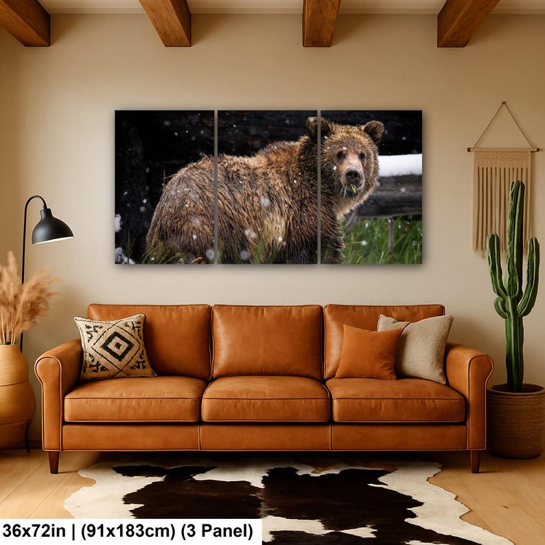 May include: A three-panel wall art set depicting a brown bear in a snowy forest environment. The artwork measures 91 by 183 cm and features the bear with thick fur, standing amidst green grass and light snowfall against a dark background.
