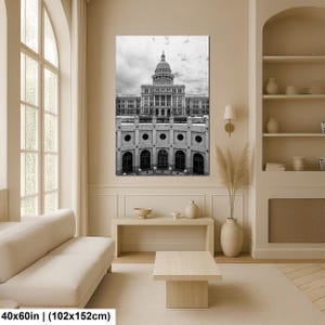 May include: A black and white wall art print depicting the Texas State Capitol building with its prominent dome and neoclassical architecture. The rectangular artwork measures 40 inches by 60 inches and features a detailed view of the structure.