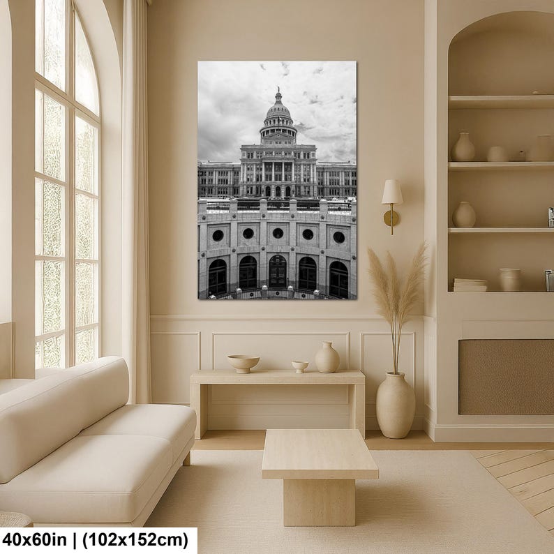 May include: A black and white wall art print depicting the Texas State Capitol building with its prominent dome and neoclassical architecture. The rectangular artwork measures 40 inches by 60 inches and features a detailed view of the structure.