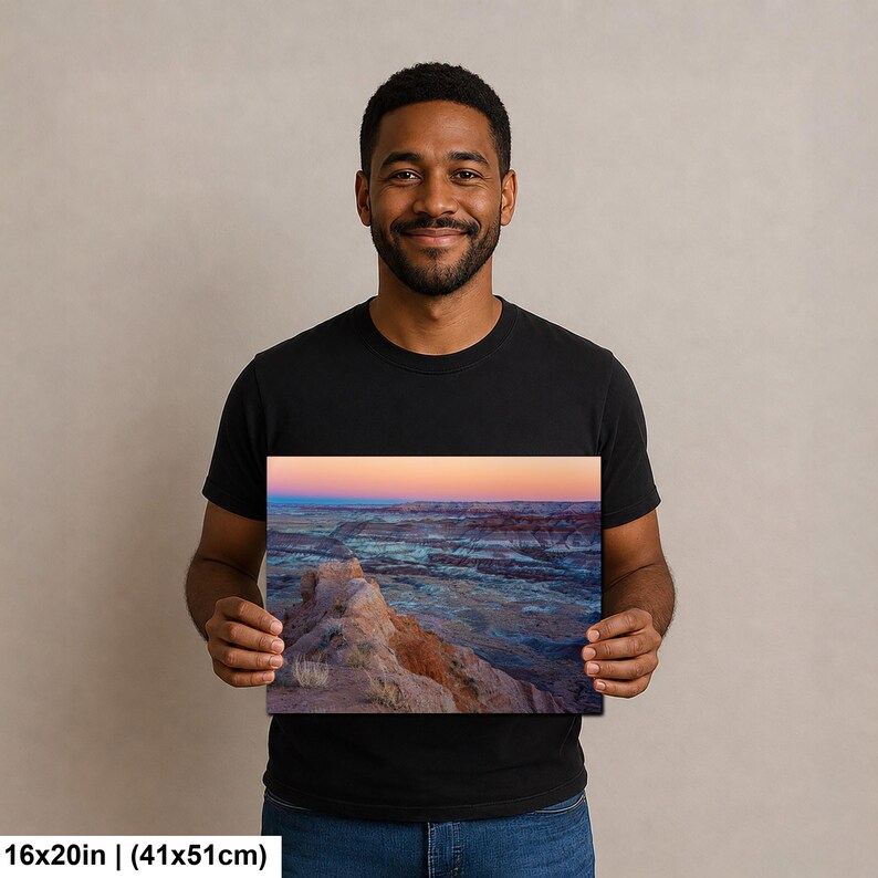 May include: A rectangular wall art print measuring 16 inches by 20 inches, featuring a landscape photograph of a desert canyon at sunset with layered rock formations in shades of orange, blue, and purple under a soft gradient sky.