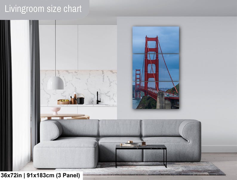 May include: A three-panel wall art set depicting the Golden Gate Bridge in red against a cloudy blue sky. The text Livingroom size chart is visible at the top, and the text 36x72in | 91x183cm (3 Panel) is visible at the bottom left.