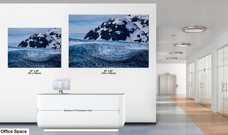 May include: Two rectangular landscape wall art prints featuring a snowy mountain peak above a dark blue glacial ice formation. The smaller print is 30 x 40 inches and the larger print is 40 x 60 inches, displayed above a 5 ft reception desk.