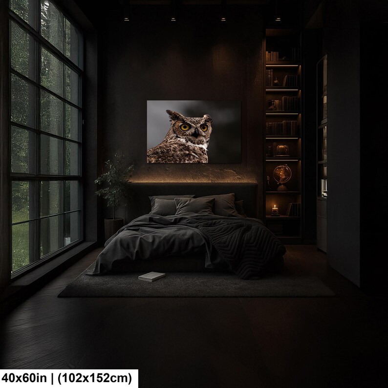 May include: A rectangular wall art print featuring a detailed portrait of a brown and white owl with piercing yellow eyes. The artwork is displayed above a bed in a dark room. The print measures 40x60 inches, as indicated by the text in the corner.