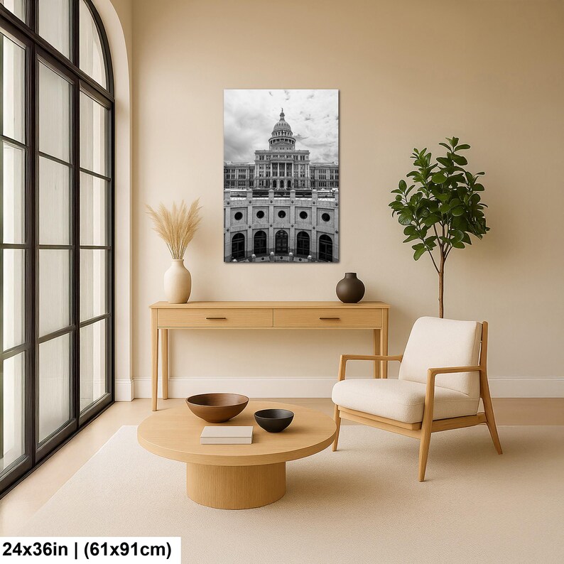 May include: A black and white wall art print featuring the Texas State Capitol building, measuring 24 by 36 inches. The vertical photograph displays the neoclassical architecture of the capitol dome and facade, presented in a clean, high-contrast monochrome style.