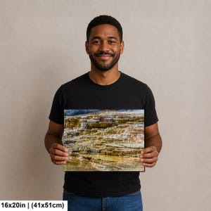 May include: A rectangular wall art print featuring a landscape photograph of tiered mineral terraces with shades of orange, brown, and white. The print measures 16 inches by 20 inches and displays a natural geological formation with water pools.