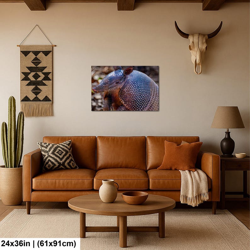 May include: A rectangular wall art print featuring a close-up of an armadillo with a textured, spotted shell. The artwork measures 24 inches by 36 inches and displays the animal in natural tones, focusing on its distinct armored plating and snout.