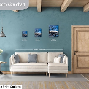 May include: A living room size chart displaying three rectangular wall art prints featuring a landscape scene with a dark blue sky and trees. The prints are labeled with dimensions of 8 by 10 inches, 11 by 14 inches, and 16 by 20 inches.