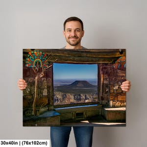 May include: A rectangular wall art print measuring 30 by 40 inches, featuring a stone-walled interior view looking out through a large window at a distant mountain landscape, with a colorful, decorative, fan-shaped art piece on the left wall.