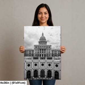 May include: A black and white rectangular wall art print featuring the Texas State Capitol building with its prominent dome and columns, measuring 24 by 36 inches. The architectural photograph captures the structure from a low angle perspective.