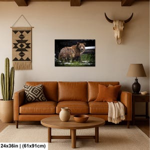 May include: A rectangular wall art print measuring 61 by 91 cm, featuring a brown bear standing in a snowy, grassy landscape. The bear is captured in profile, looking toward the viewer amidst light snowfall and dark, blurred background foliage.