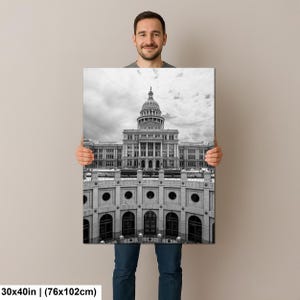 May include: A rectangular wall art print featuring a black and white architectural photograph of the Texas State Capitol building, showcasing its central dome and neoclassical facade, measuring 30 by 40 inches in total physical dimensions.