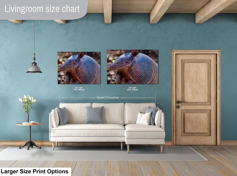 May include: A living room size chart featuring two rectangular wall art prints of an armadillo displayed above a cream-colored sectional sofa. The prints are labeled with dimensions of 30 x 40 inches and 32 x 48 inches, showing scale relative to a 7-foot couch.