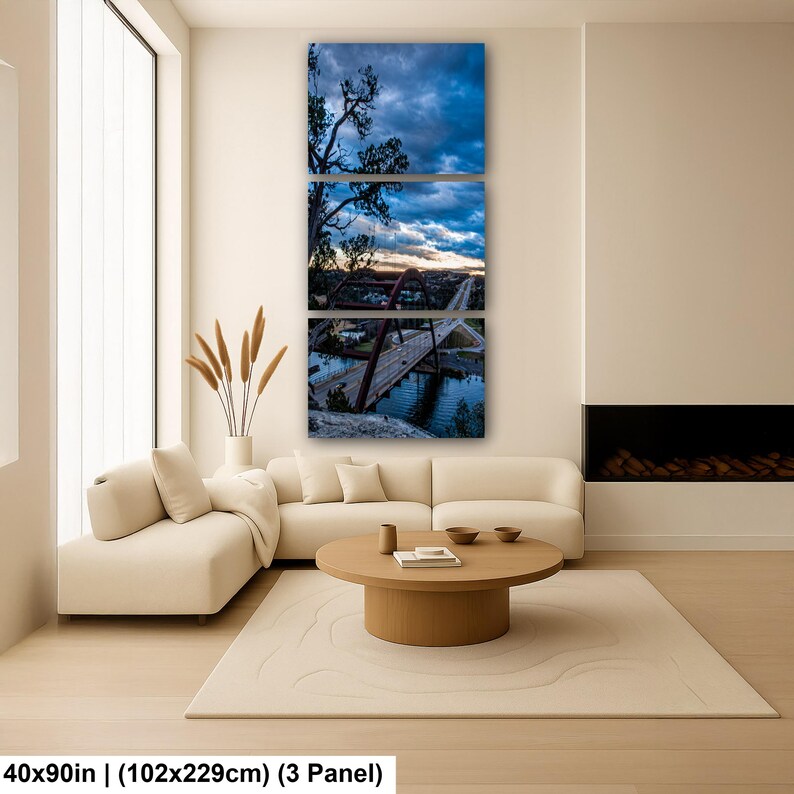 May include: A three-panel wall art set depicting a landscape with a red arched bridge over a body of water under a cloudy blue sky. The artwork measures 40 by 90 inches in total. The scene features a silhouette of a tree and a road.