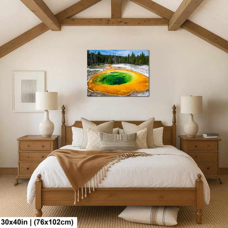 May include: A rectangular wall art print featuring a vibrant geothermal pool with a deep green center surrounded by bright orange and yellow mineral deposits, set against a forest backdrop, measuring 30 by 40 inches in total dimensions.