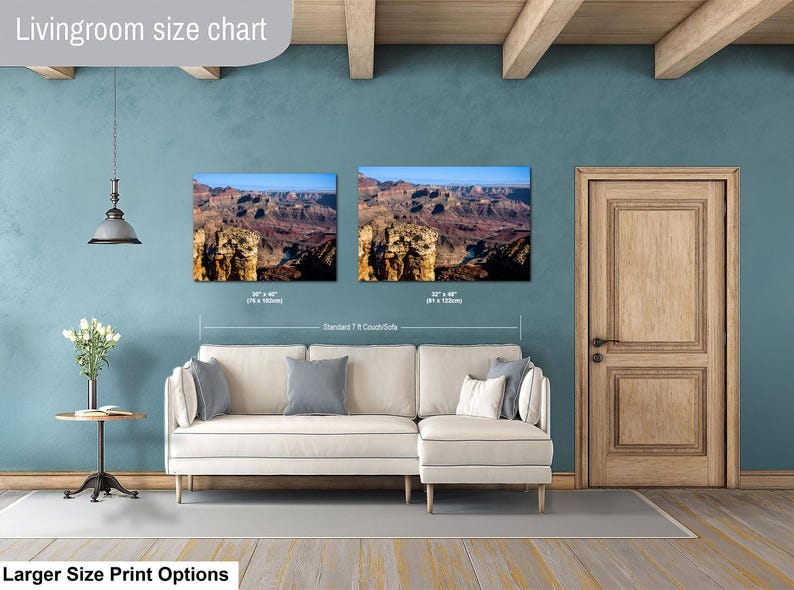May include: A living room size chart displaying two rectangular landscape wall art prints of the Grand Canyon above a white sectional couch. The prints are labeled with dimensions of 30 x 40 inches and 32 x 48 inches, with a 7 foot couch reference.