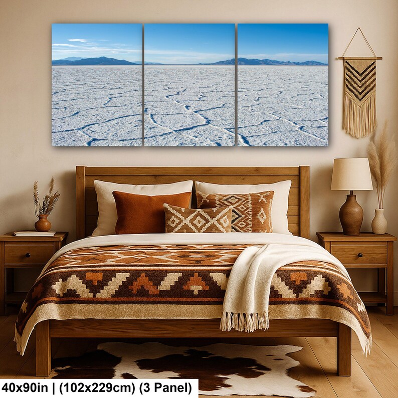 May include: A three-panel wall art set depicting a vast white salt flat landscape under a clear blue sky, measuring 40 by 90 inches. The panoramic scene features cracked white ground textures extending toward distant blue mountains on the horizon.