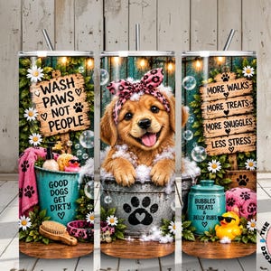 May include: A cylindrical tumbler featuring a golden puppy wearing a pink leopard print headband in a metal tub with bubbles. The design includes text reading Wash Paws Not People, More Walks More Treats More Snuggles Less Stress, and Good Dogs Get Dirty.