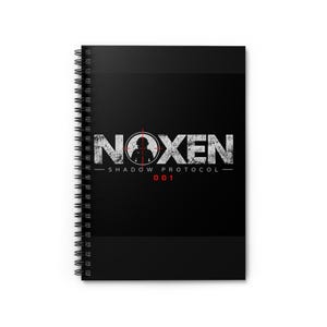 May include: A black spiral-bound notebook featuring a white distressed graphic on the front cover. The design displays the text NOXEN with a red crosshair target symbol over the letter O, followed by the text SHADOW PROTOCOL and the number 001.
