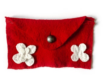 May include: A red felt envelope with two white felt flowers and a silver button.