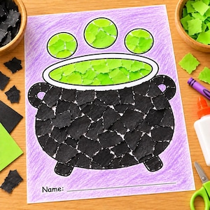 May include: A paper craft activity sheet featuring a black cauldron filled with green liquid, decorated with torn black and green paper pieces. The background is colored with purple crayon, and the sheet includes a line for a name at the bottom.