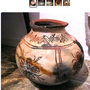 May include: Hand-painted, round earthenware pot with a wide opening and a dark rim. The pot features tribal-style geometric patterns in red and black around the top, with floral or insect-like designs in brown and black on the body.