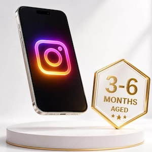 May include: A smartphone displaying a glowing neon Instagram logo on its screen, positioned next to a white hexagonal plaque with a gold border. The plaque features the gold text 3-6 MONTHS AGED with three small stars underneath the lettering.