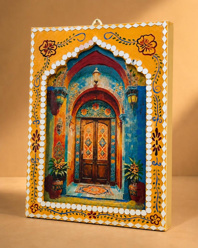 May include: A rectangular wall art piece featuring a painted scene of a wooden double door framed by an archway. The border is yellow with hand-painted floral motifs and small white mirror tiles. The scene includes blue walls, lanterns, and potted plants.