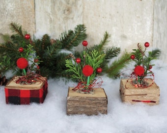 Set of 3 Charming Rustic Wooden Blocks for a Sparkling Christmas Decoration Topped with Artificial Green Plants