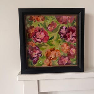 May include: A square painting in a black frame featuring an abstract floral pattern with layered brushstrokes in shades of magenta, deep red, orange, and light pink against a muted lime green background. The artist signature Hawkins is visible.