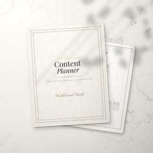 May include: A white content planner with a thin black border and the text The Creator Content Planner and Northbound Studio printed on the front cover. The planner includes sections for a calendar, ideas bank, pillars, weekly map, and setup guide.