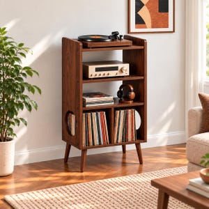 May include: A dark wood record player stand with four tapered legs, featuring a top shelf for a turntable, a middle shelf for an amplifier and headphones, and lower compartments for vinyl records with circular side cutouts for storage.