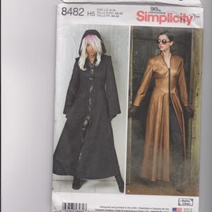 May include: Simplicity sewing pattern 8482 H5 for a long coat with a front zipper. The envelope displays two variations: a black hooded coat and a brown high-neck coat. The pattern includes size information for U.S. sizes 6-14 and Euro sizes 32-40.