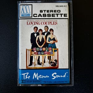 May include: A Motown stereo cassette tape for the original motion picture soundtrack Loving Couples. The cover features four people standing behind a wooden crib with colorful letter blocks spelling Loving Couples and the text The Motown Sound.
