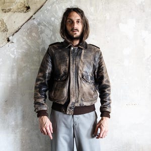 Vintaged Rugged A-2 Flight Leather Jacket 1980s . French Vintage trashed Bomber Jacket Boho