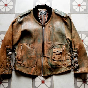 Veste motard western cowboy des années 1970.  Blouson Avirex Style Rockabilly South West en cuir effet vieilli
