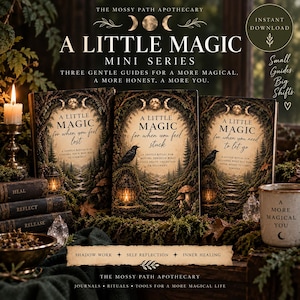 May include: Three books titled A Little Magic Mini Series with covers depicting forest paths, lanterns, and ravens. Text includes A Little Magic for when you feel lost, stuck, or need to let go. Includes a candle, crystals, and a mug labeled A More Magical You.