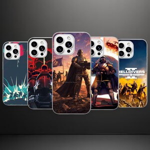 May include: Five smartphone cases featuring various Helldivers 2 graphic designs. Each case displays a unique scene with armored soldiers, futuristic weaponry, and dramatic landscapes. The rightmost case prominently features the Helldivers 2 logo.