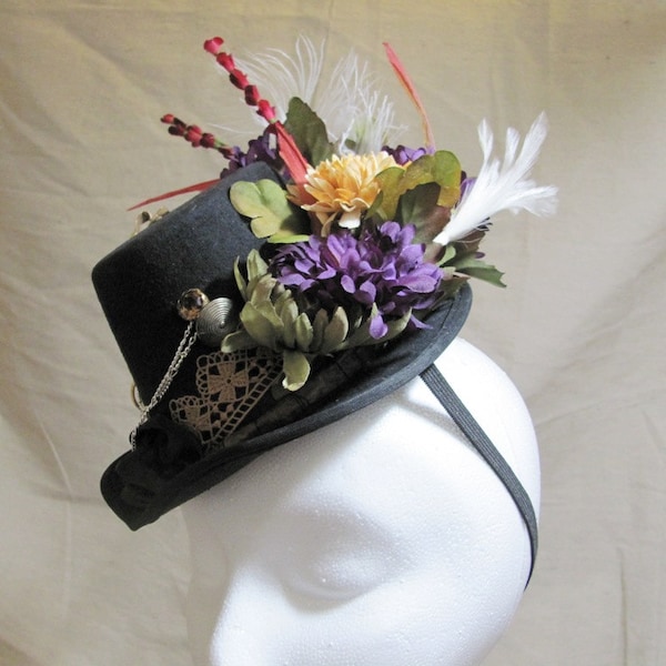 Steampunk Fascinator Hat in Black with Purple Green Red Beige silk flowers Vintage jewelry feathers Lace chains romantic costume Halloween