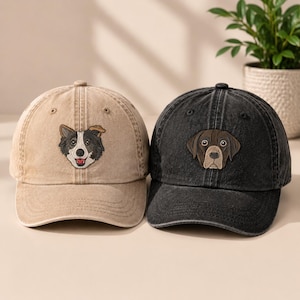 May include: Two baseball caps with embroidered dog portraits. The left cap is tan with a black and white border collie design. The right cap is black with a brown and tan labrador retriever design. Both hats feature a six-panel construction.