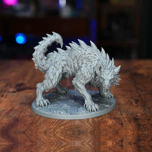 May include: A gray, unpainted miniature figurine of a snarling, wolf-like creature with sharp, spiked fur along its back and a curled, textured tail. The beast stands in a low, aggressive stance on a circular base with a detailed, uneven surface.